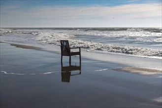 Upholstered chair washed up on the North Sea shore, flotsam, Oksbol, Region Syddanmark, Denmark,