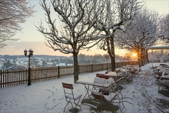 Snow-covered beer garden in winter, sunset, Andechs Monastery, Fuenfseenland, Pfaffenwinkel, Upper
