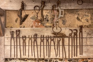 Rusty tongs and tools, blacksmith's forge, blacksmith, inner courtyard, Ronneburg Castle, medieval