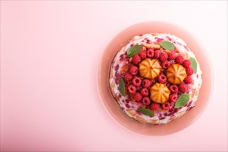 Homemade jelly cake with milk, cookies and raspberry on a pink background. top view. flat lay, copy