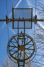 Large wheel on the end mast of a disused ski lift on the Buchenberg, Buchenberg, Allgaeu, Bavaria,