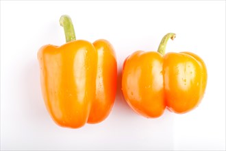 Two yellow sweet peppers isolated on white background. closeup