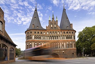 A bus passes the Holsten Gate in Luebeck