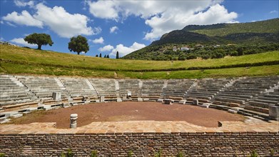 Ruins of an ancient theatre with seating steps standing out against the blue sky, Ancient theatre,