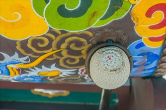 Closeup of drumstick in ring attacked to colorful Korean traditional drum in South Korea