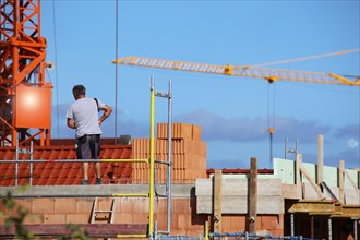 Construction worker (bricklayer) on the building site (Mutterstadt development area,
