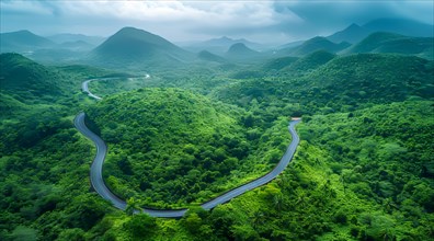 Winding road cutting through lush green mountainscape with hills under a cloudy sky, ai generated,