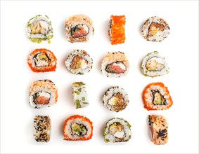 Set of Japanese maki sushi rolls in a rows with salmon, sesame, avocado, cheese and cucumber