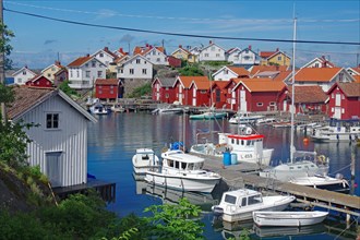 Fishing huts, houses and small boats on the car-free island of Gullhomen, Idyll, Oerust, Sweden,