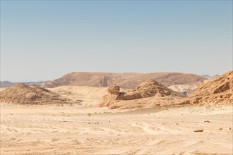 Desert, red mountains, rocks and blue sky. Egypt, the Sinai Peninsula, Dahab