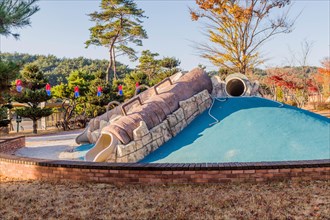 Playground slides in wilderness park in Pohang, South Korea, Asia