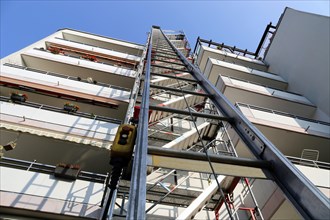 Construction hoist, ladder lift at a construction site