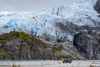 Passengers of the cruise ship Stella Australis stand at the foot of the Aguila Glacier, Alberto de