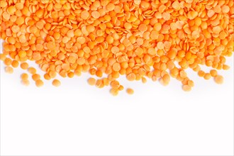 Texture of red lentils isolated on white background. Top view