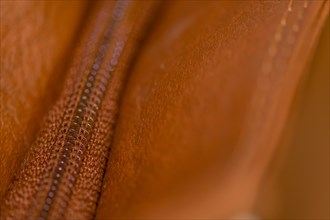 Closeup of zipper in leather shoulder bag