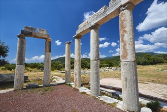 Historical column ruins in front of a sunny sky in Greece, Stoa of the Agora, Archaeological site,