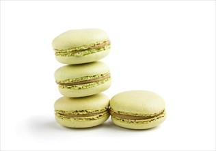 Green macarons or macaroons cakes isolated on white background. side view, close up, macro