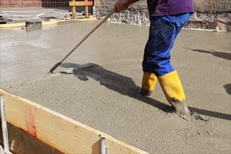 Concreting a floor slab with ready-mixed concrete on the construction site of a residential