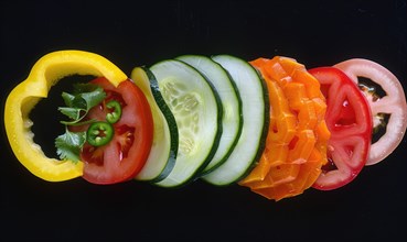 Sliced vegetables on a black background. Vegetarian food. AI generated