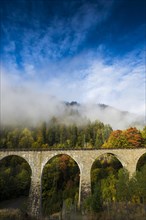 Railway bridge in the Ravenna Gorge, Hoellental in autumn, near Freiburg im Breisgau, Black Forest,