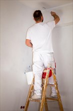 Painter renovates an old flat
