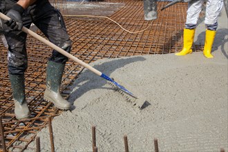 Delivery of ready-mixed concrete to the construction site of a residential building in a new