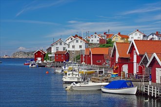 Fishing huts, houses and small boats on the car-free island of Gullhomen, Idyll, Oerust, Sweden,