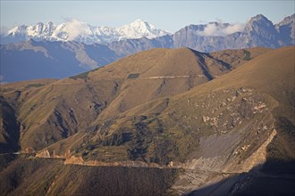 Road through the Andean highlands, snow-capped Andes in the background, Andahuaylas, Apurimac.