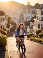 Energetic plus size young asian woman riding a bike downhill in the city during sunset, wearing