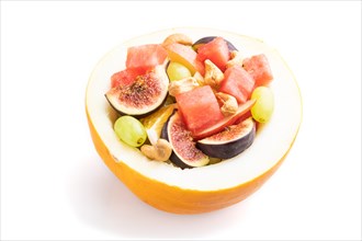 Vegetarian fruit salad of watermelon, grapes, figs, pear, orange, cashew isolated on white