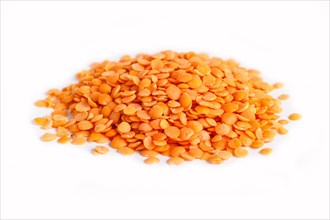Pile of red lentils isolated on white background. Closeup