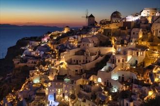 View of Oia at sunset, Santorini, Cyclades, Greece, Europe