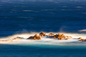 The sea washes around an offshore reef, long exposure, La Crucecita, Baja de Huatulco, South