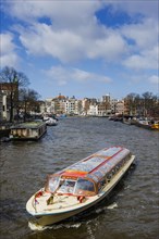 Canal cruise with typical tourist boat, tour, canal tour, city tour, tourism, city trip, holiday,