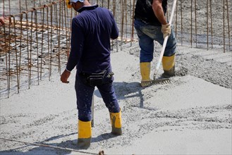 Concreting a floor slab with ready-mixed concrete on the construction site of a residential