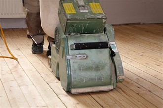 A parquet floor is sanded and oiled