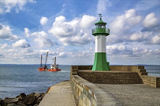 A ship passes the Sassnitz lighthouse on the island of Ruegen