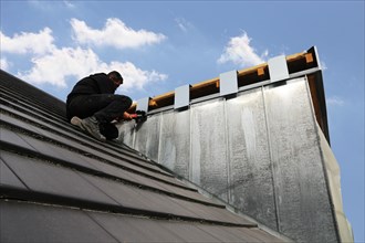 Roofer working on a new dormer window (model relased)