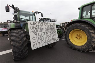 Are imports climate-neutral, placard on a tractor, farmers' protests, demonstration against