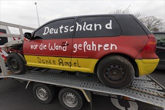 Accident car painted in Germany colours, with the inscription Deutschland vor den Wand gefahren,