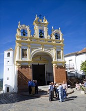 Men gather by the baroque church of San Juan at Zahara de la Sierra, Spain Sunday 13 October 2013