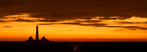 Lighthouse Westerheversand at sunset in summer, Westerhever, Wadden Sea National Park, North