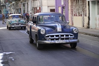 Several vintage cars from the 1950s in the centre of Havana, Centro Habana, Cuba, Central America