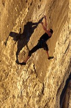 Climber in route called La Rose et le Vampir, 8b, in Buoux, Haute Provence, France, vintage, retro,