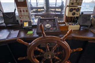 Interior view steering wheel, helm, bridge, bridge, tourist ship, excursion boat, pirate ship