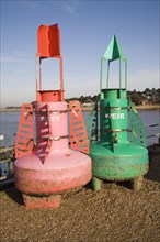 Red and green marine navigation buoys, Felixstowe Ferry, Suffolk, England, United Kingdom, Europe