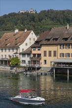 Stein am Rhein, Hohenklingen Castle, mountain, restaurant on the water, sports boat, blue sky,