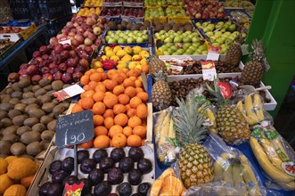 Display of fresh fruit, fruit, oranges, pineapples, bananas, kiwi, apples, plums, fruit vendor,