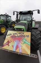 We stick together, sign on a tractor, farmers' protests, demonstration against policies of the