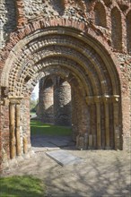Elaborate Norman doorway of the west front of Saint Botolph's priory, Colchester, Essex, England,